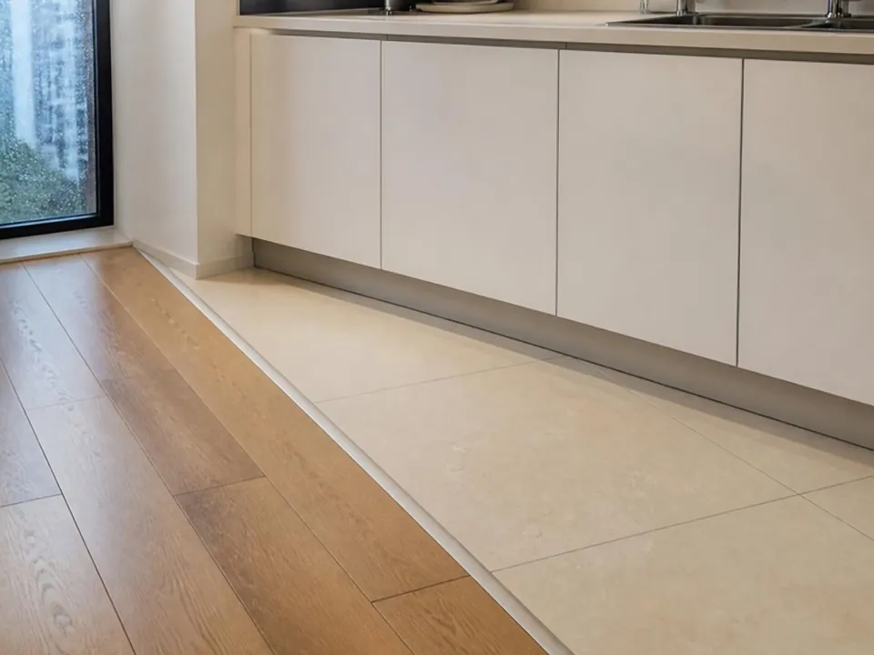 AI image of the joint where a vinyl floor meets kitchen tiles
